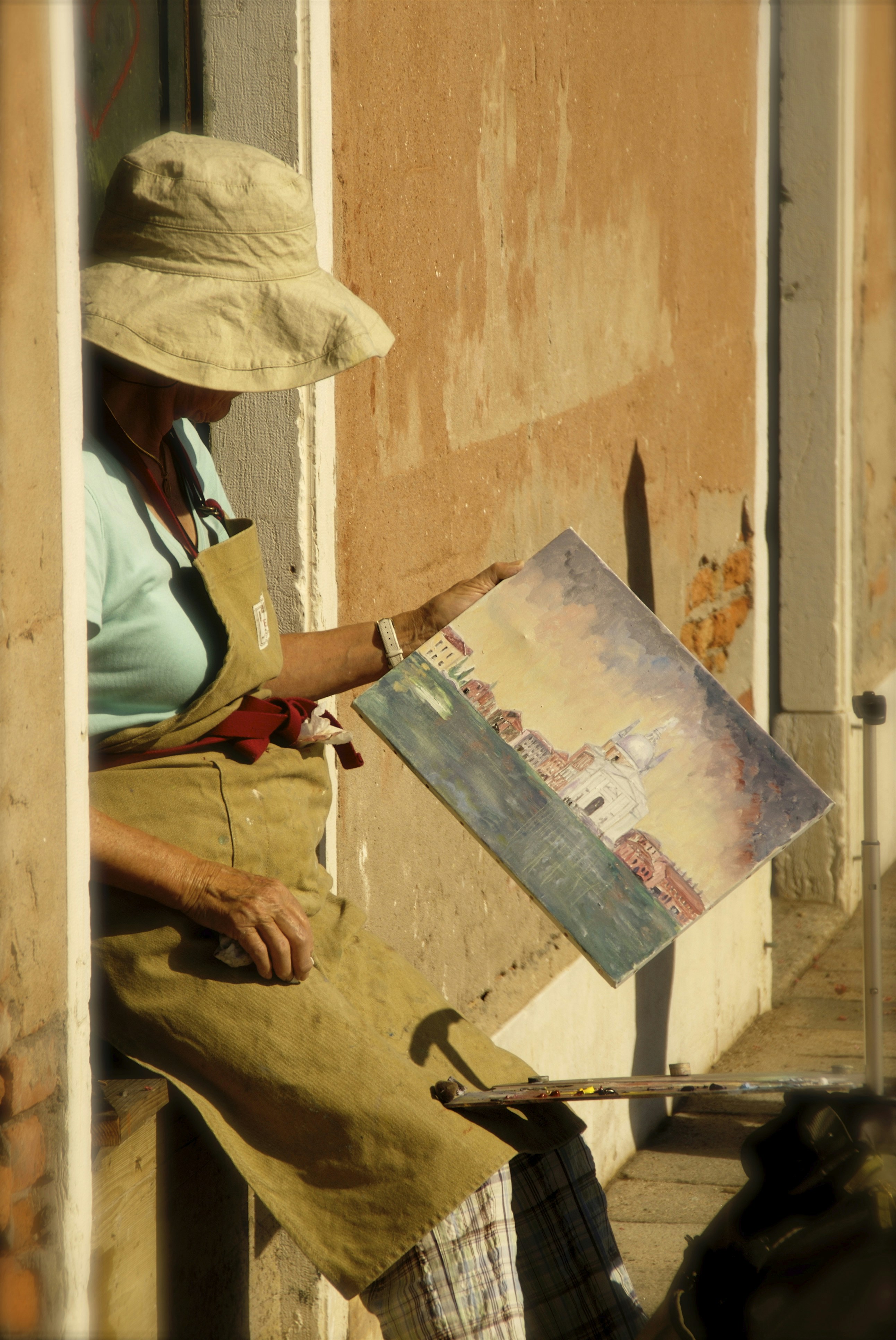 A painter at work, with a canvas and vibrant colors