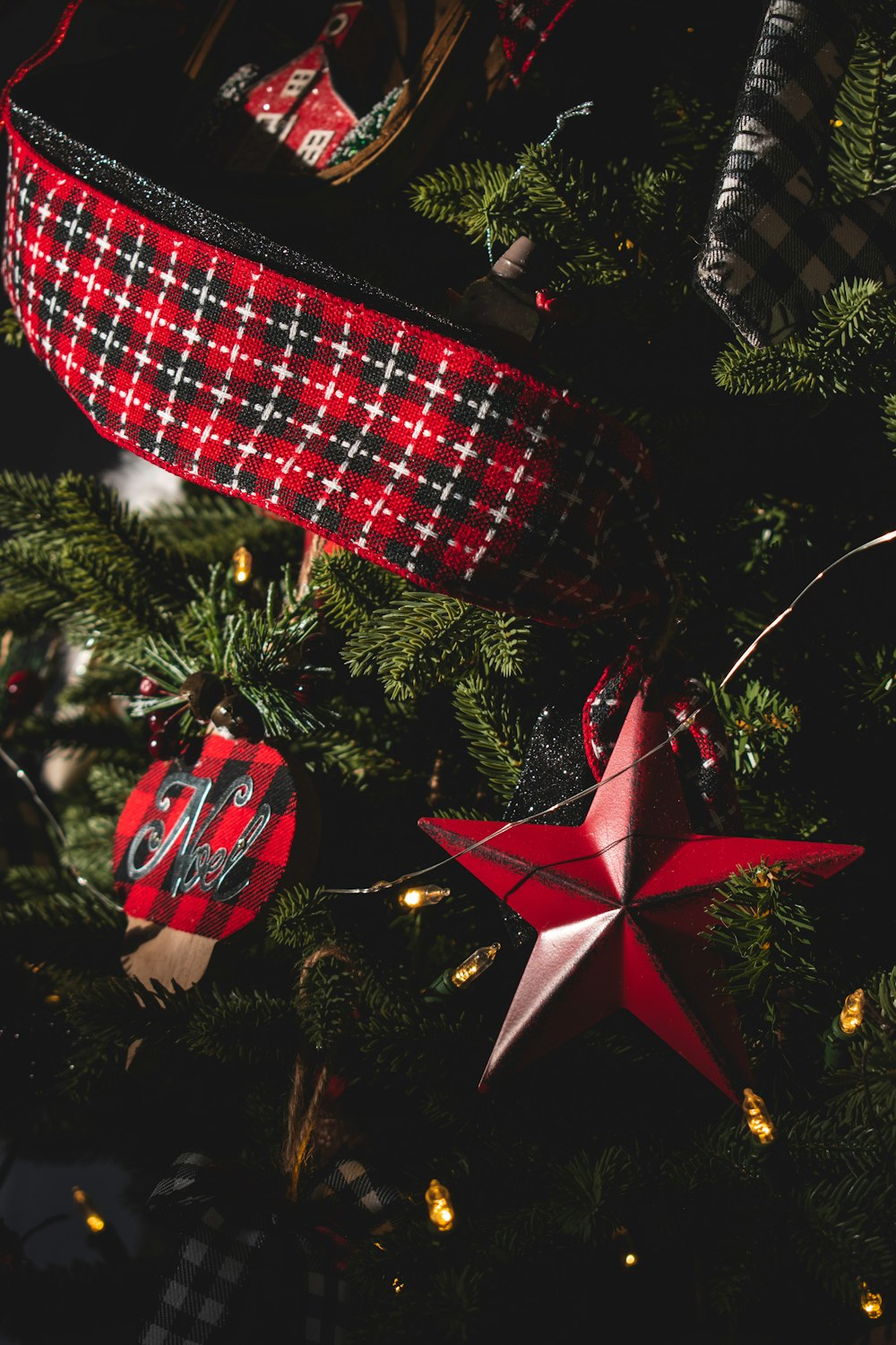 red and white plaid ribbon on green christmas tree