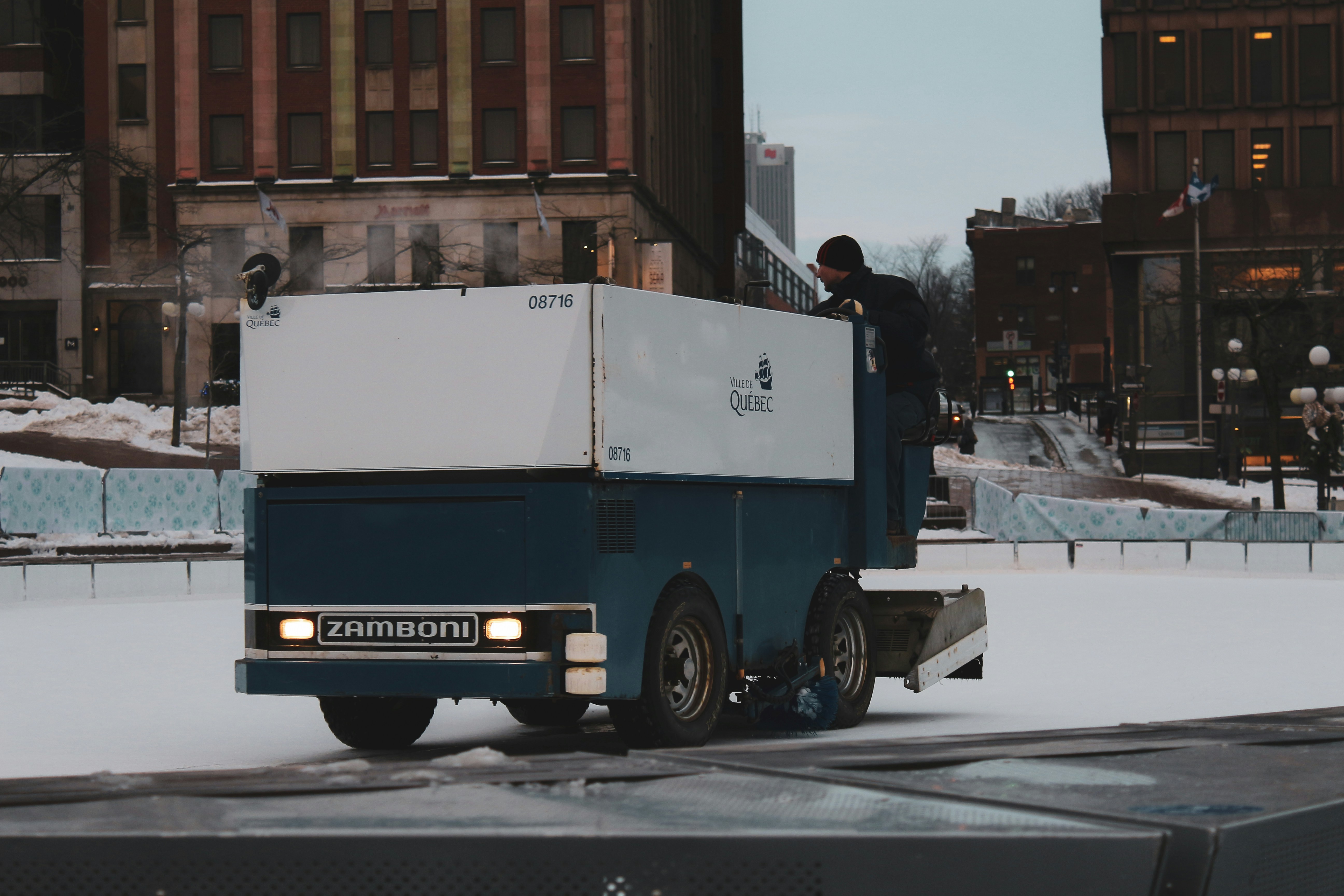 blue and white truck on road during daytime granular teams background