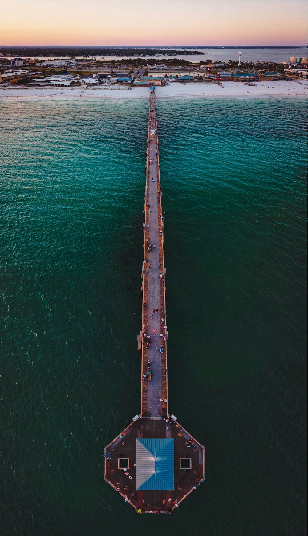 brown wooden post on body of water during daytime