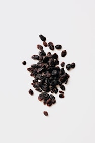 black round fruits on white background