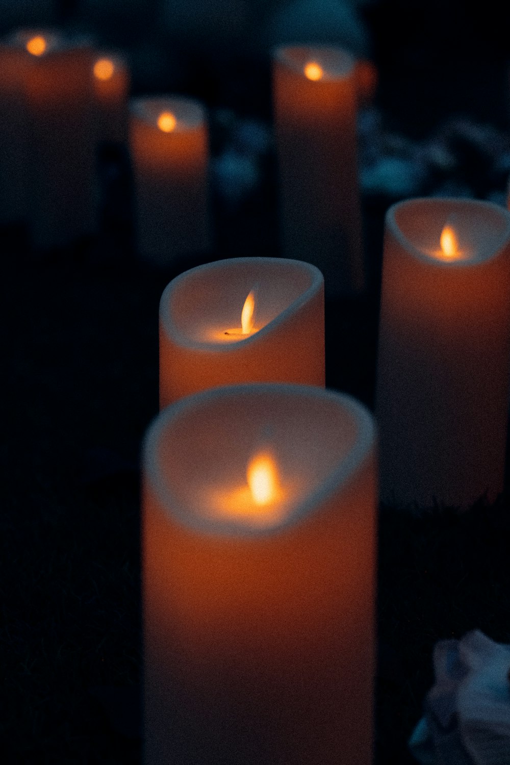 red candles on black textile