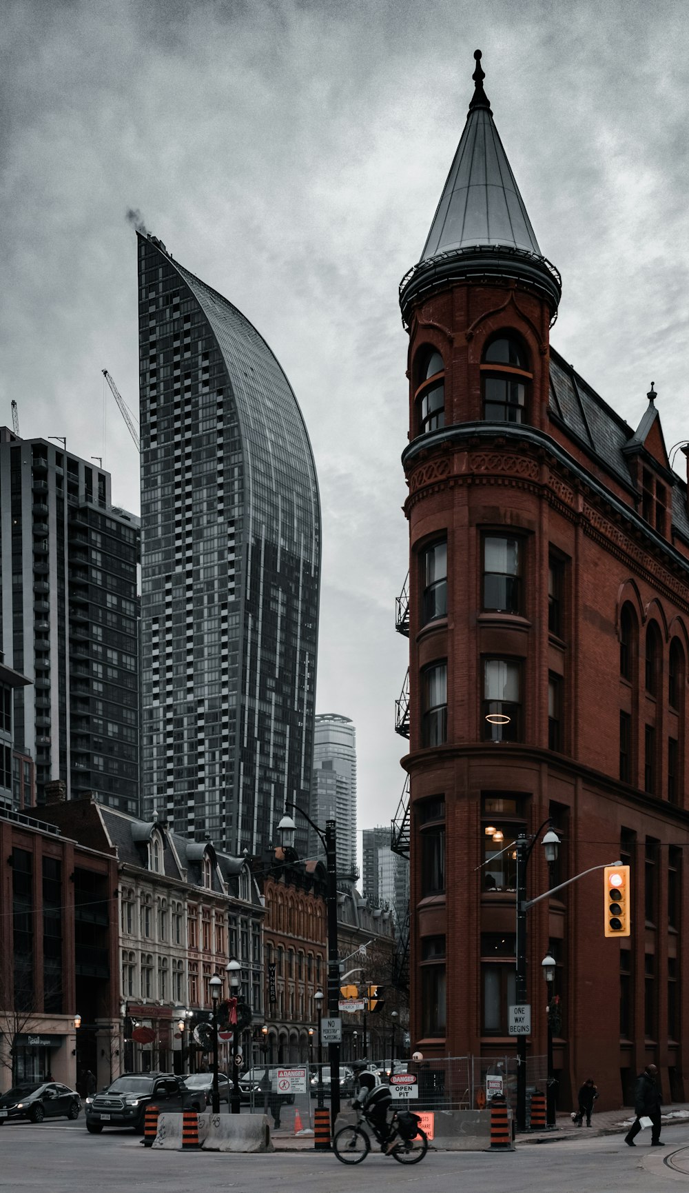 brown and white concrete building under gray sky