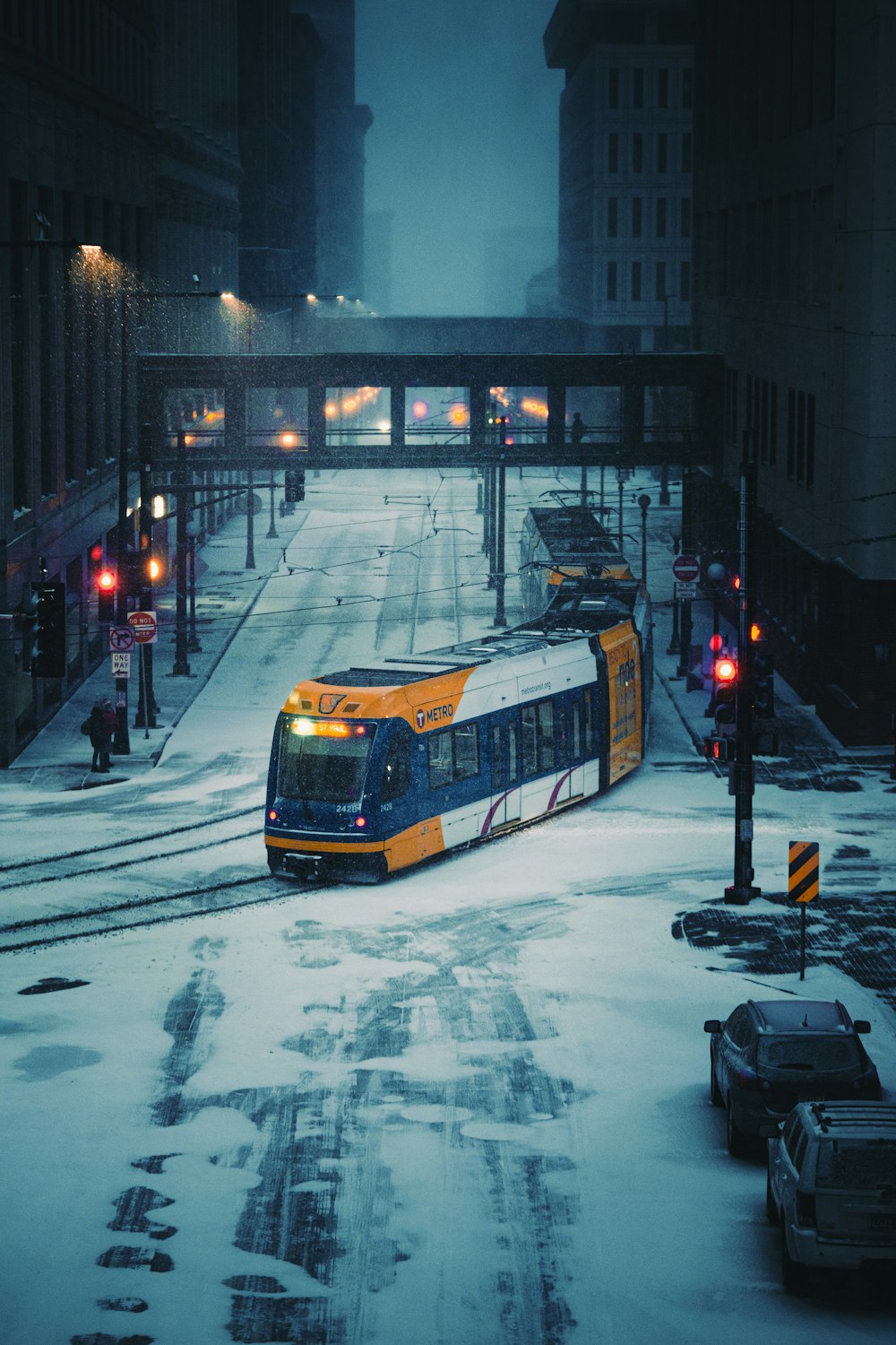 yellow and black tram on road during night time