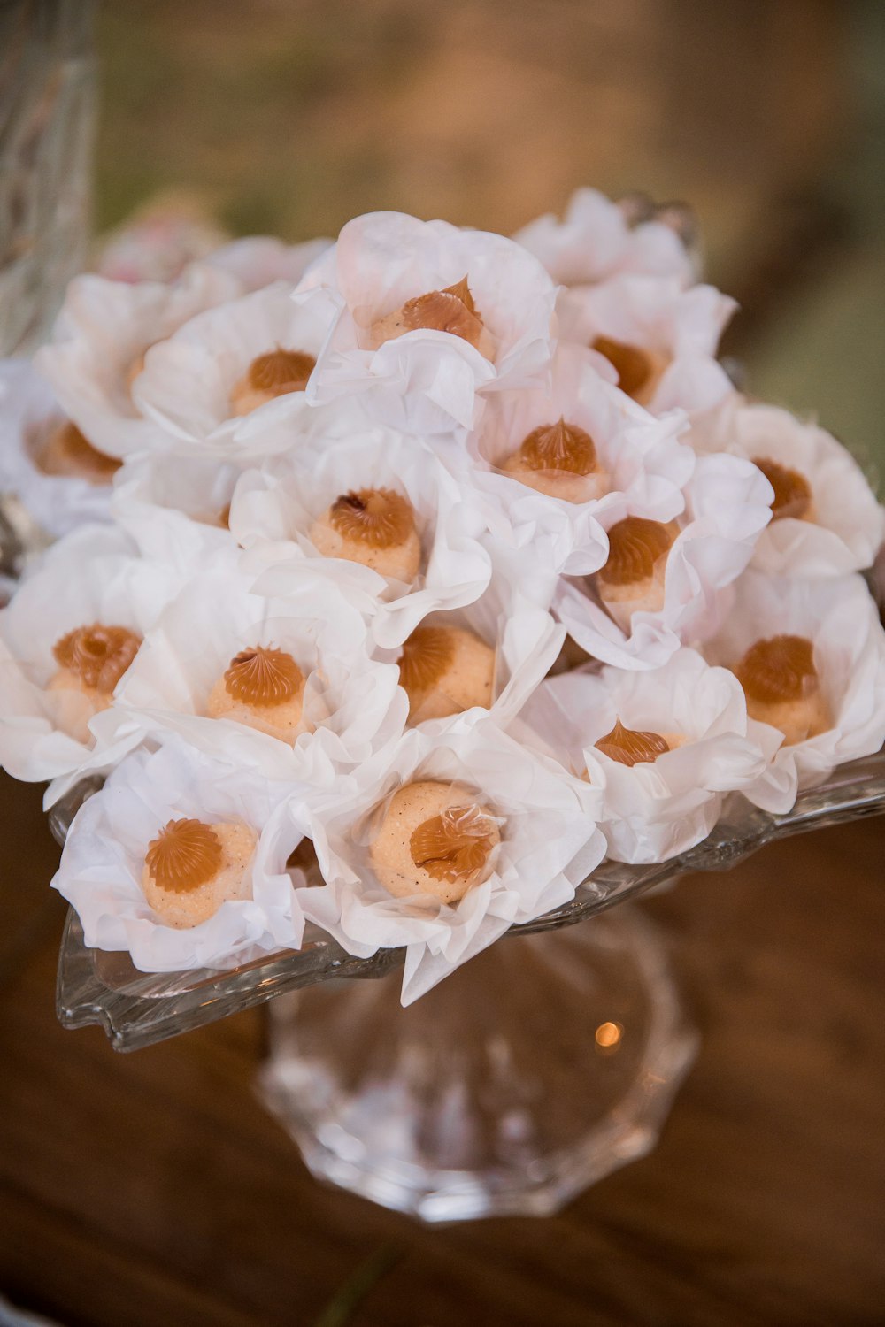 white flowers in clear glass vase