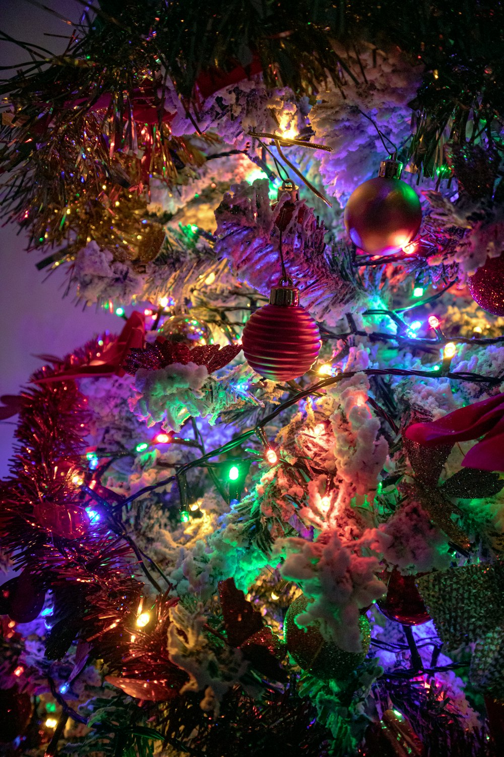 green christmas tree with baubles and string lights