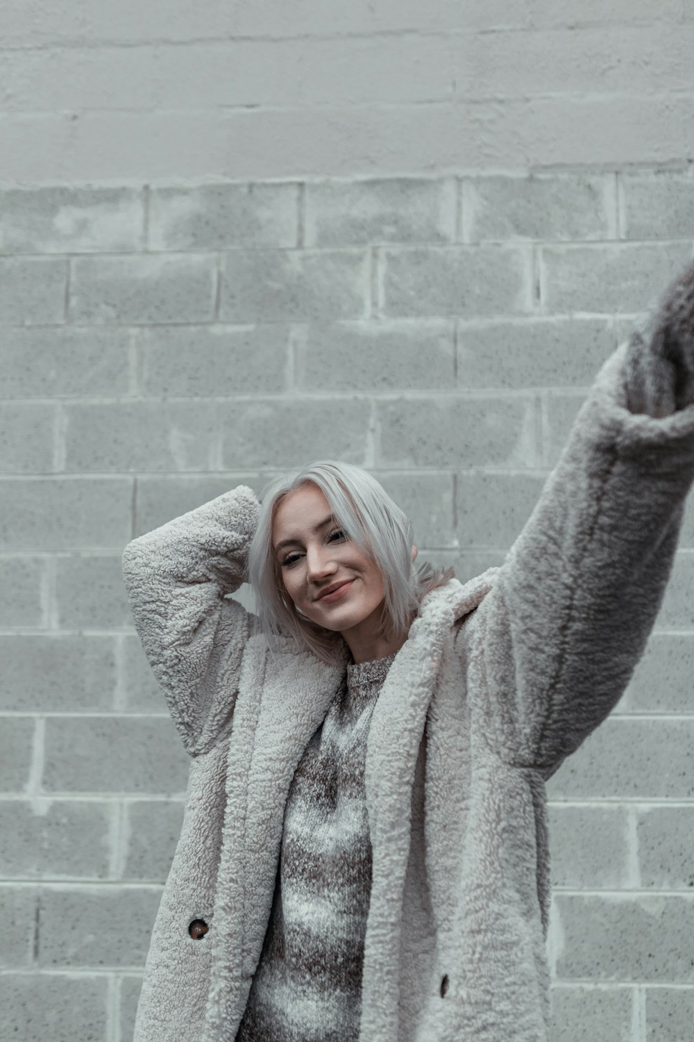 woman in gray knit sweater