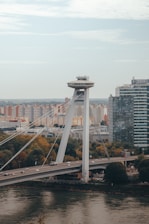 white bridge over city buildings during daytime