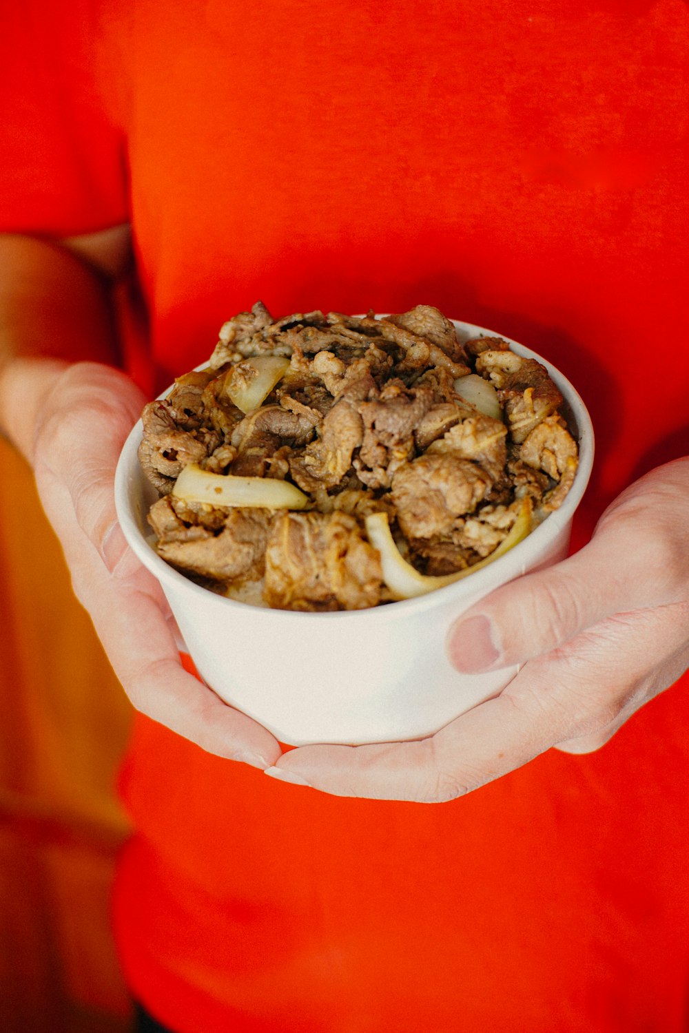 brown and green food on white ceramic bowl