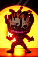 A fierce villain illustrated with bold lines and glowing red eyes, capturing classic comic menace.