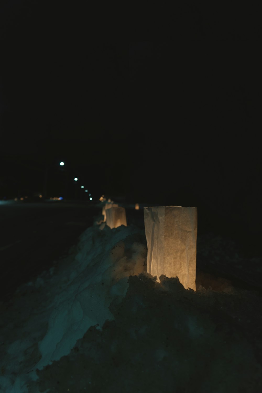 person in white snow covered ground during night time