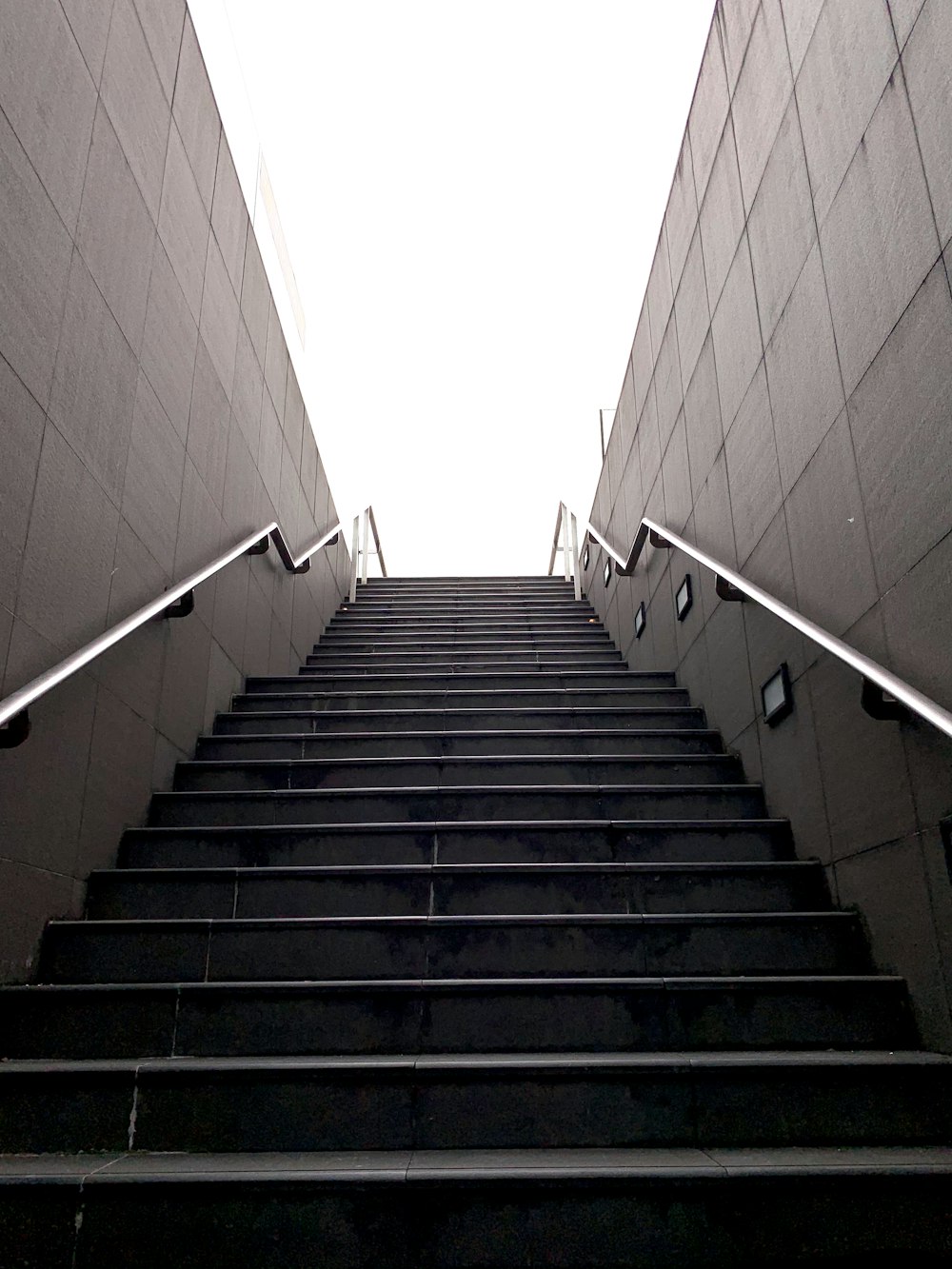 black staircase with white railings