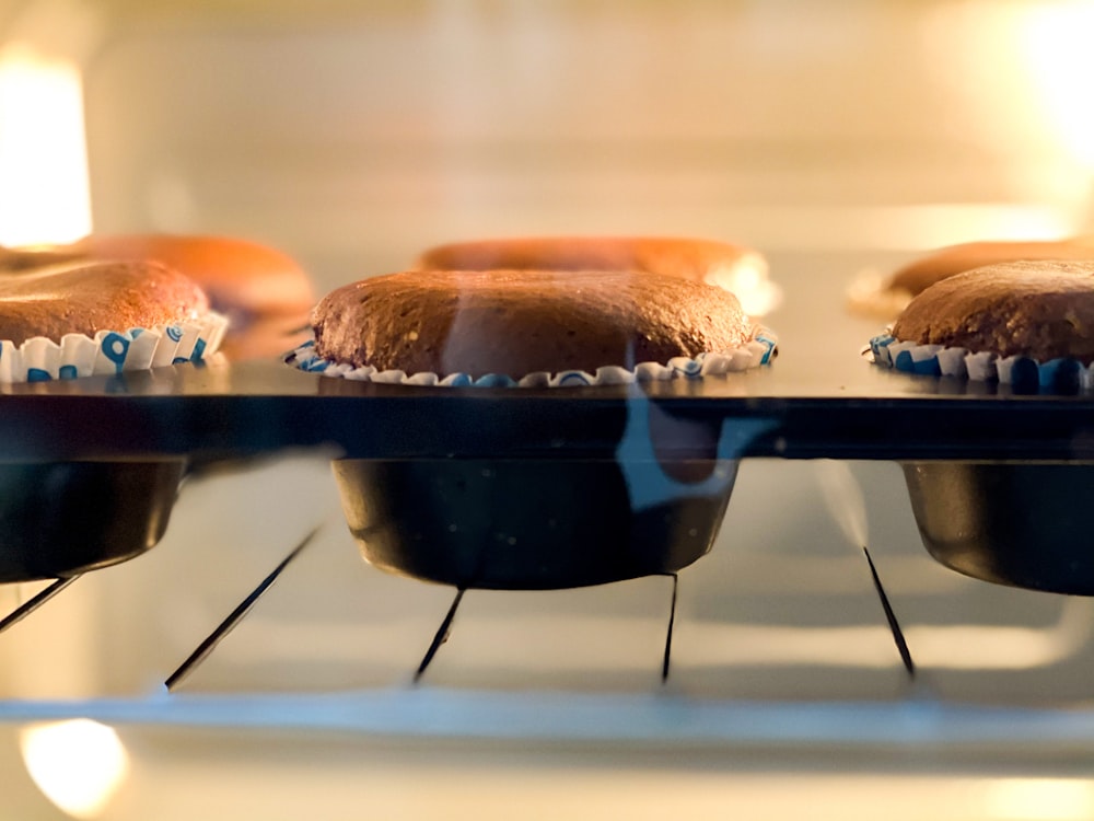 brown and black burger on blue tray