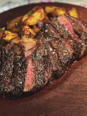 grilled meat on brown wooden table
