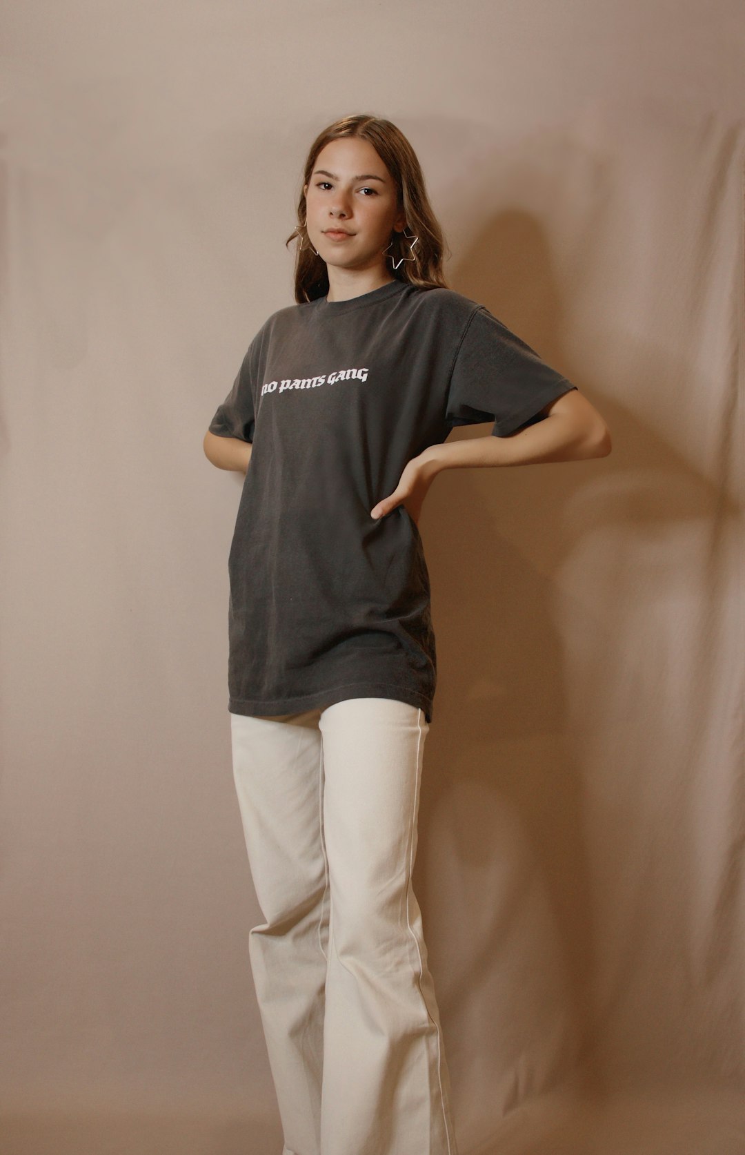 woman in black crew neck t-shirt and white pants