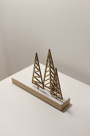 brown wooden pyramid on white table