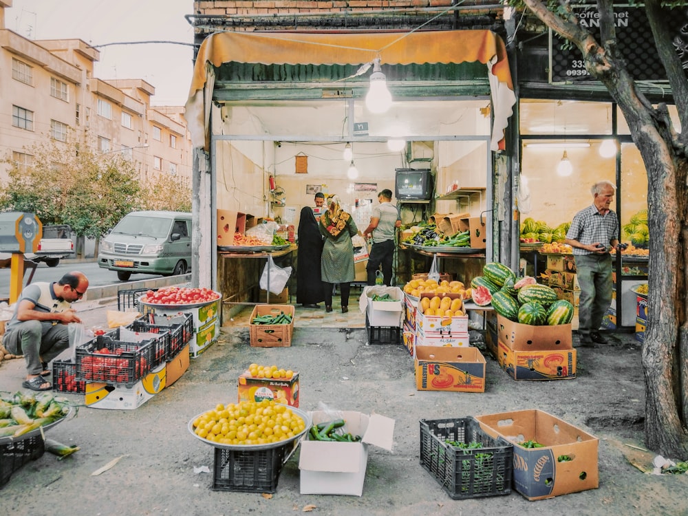 people standing in front of food stall during daytime