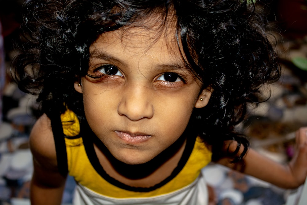 boy in white and yellow crew neck shirt