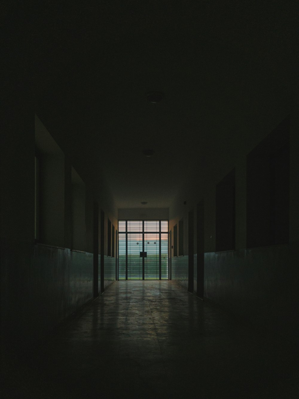 hallway with white walls and windows