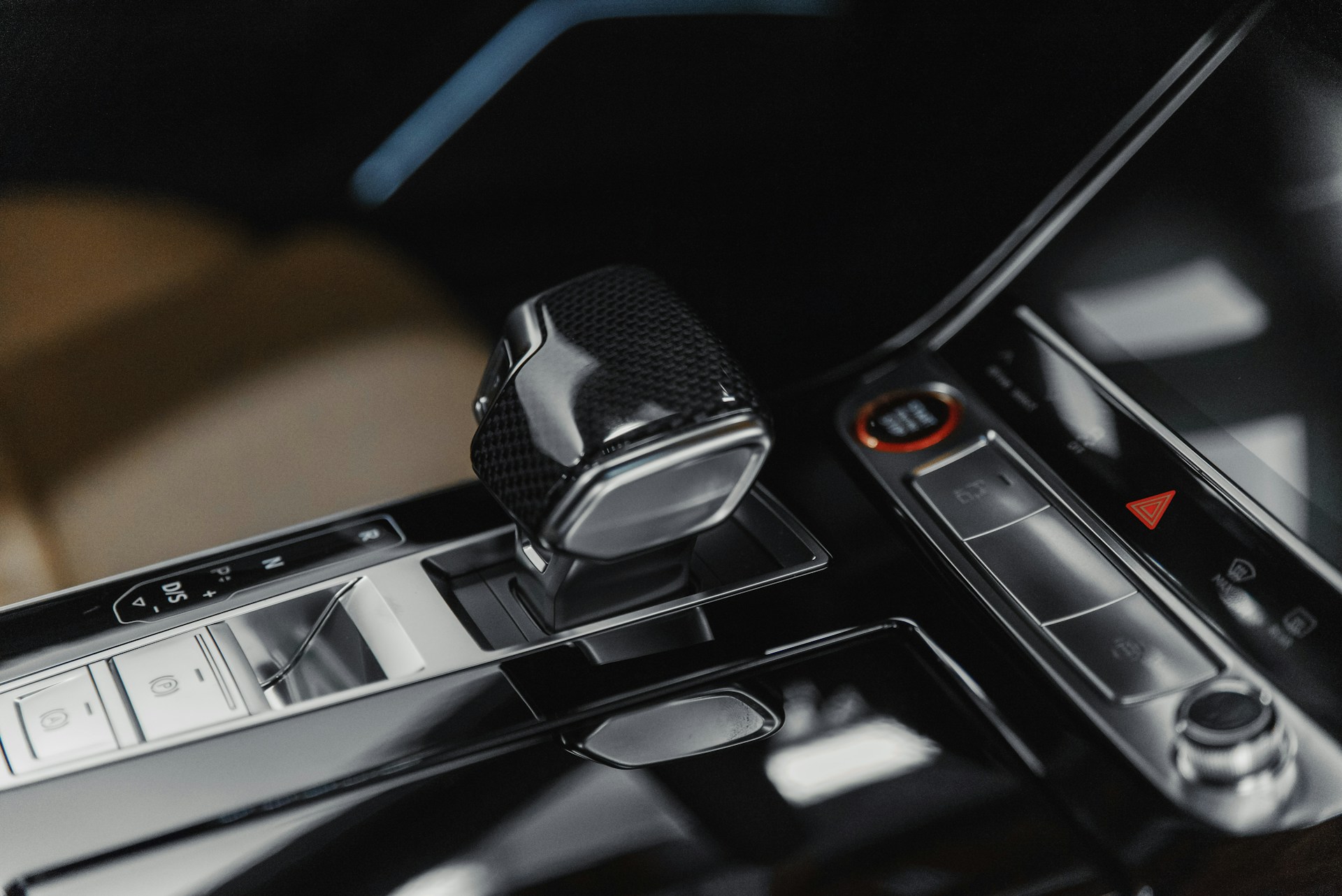 black and silver car gear shift lever