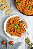 pasta with sauce on white ceramic plate