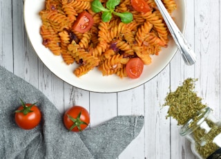 pasta with sauce on white ceramic plate