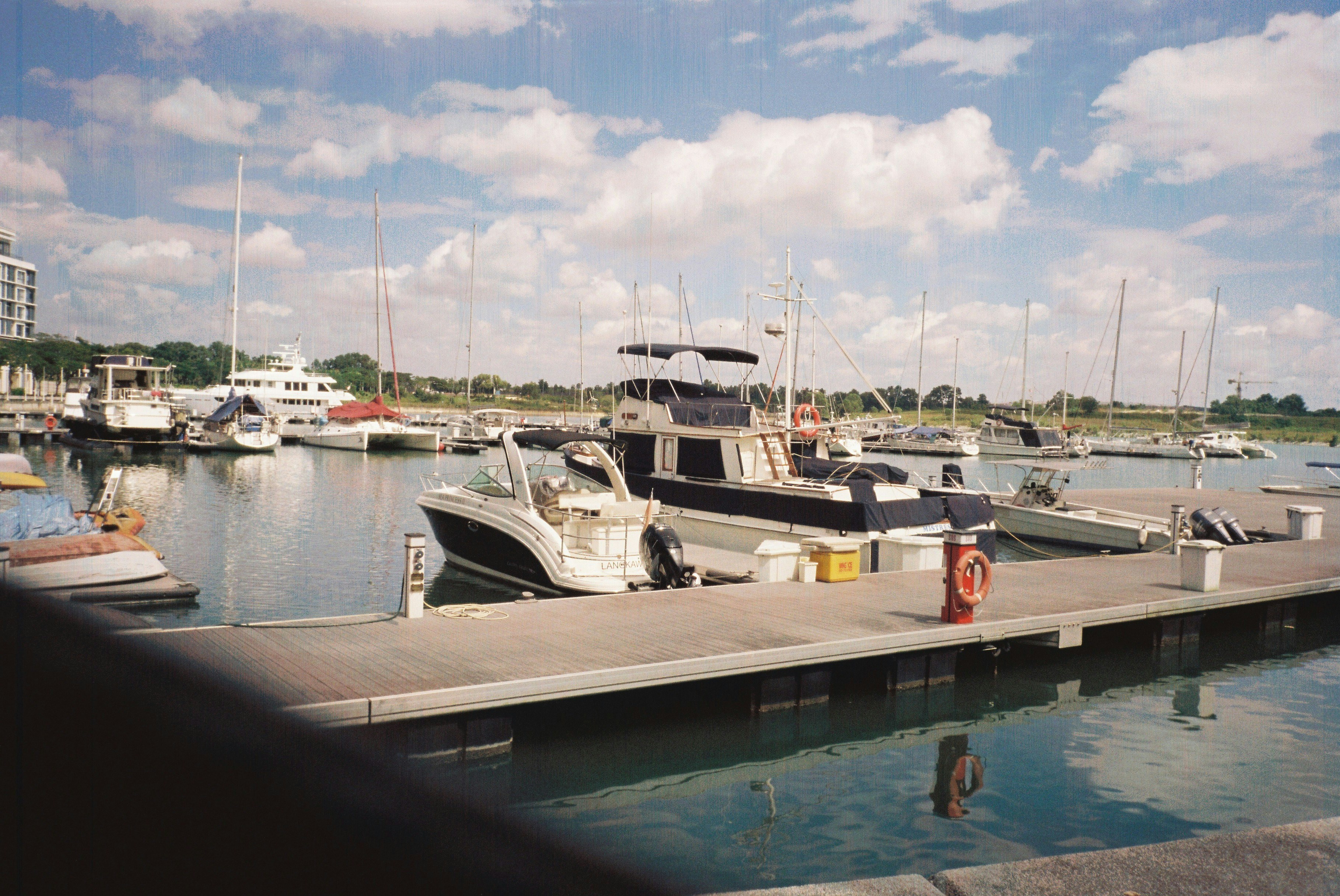 white yacht on dock during daytime