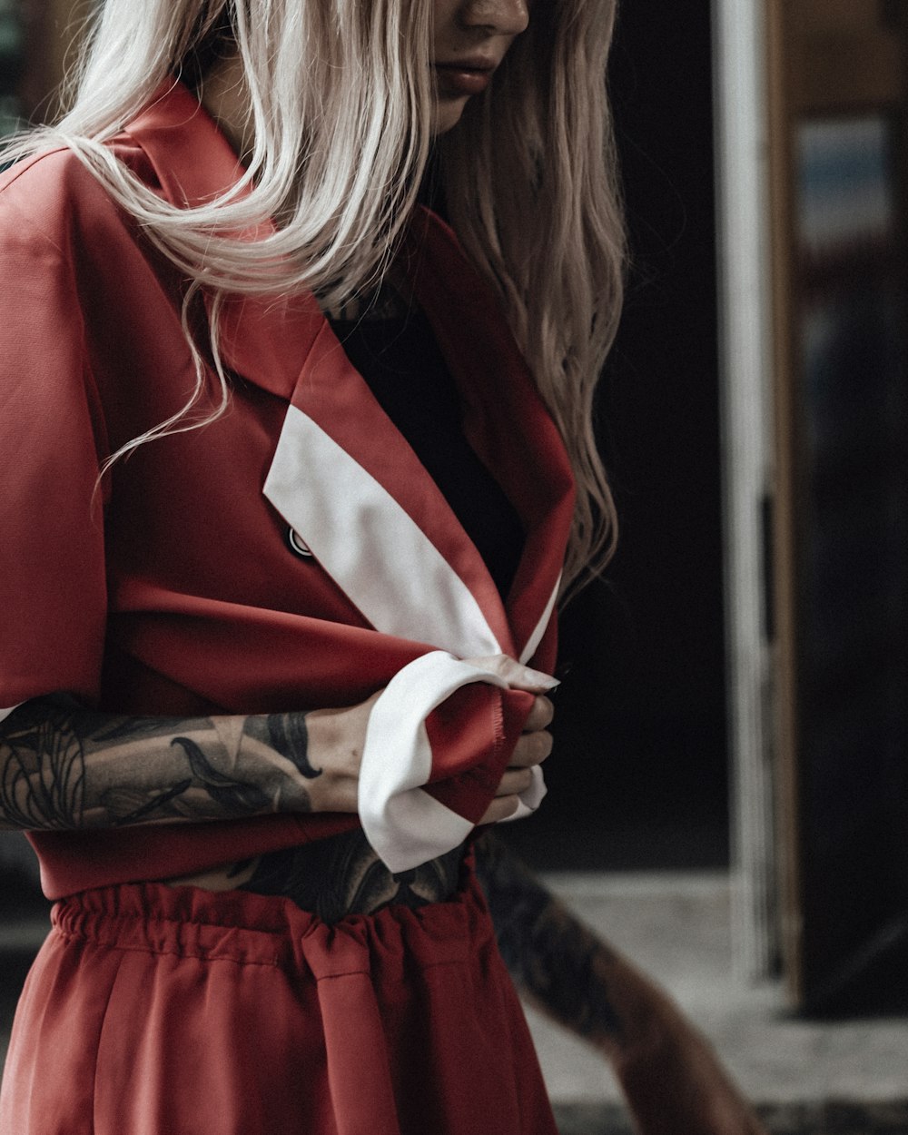 woman in red and white long sleeve shirt