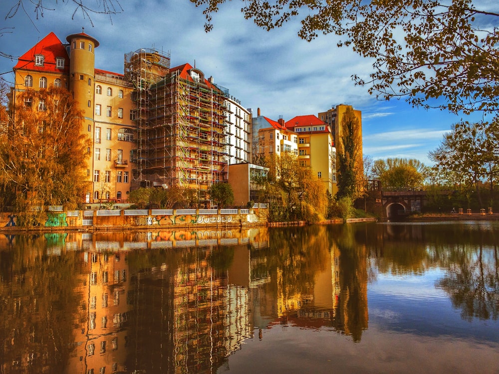 brown concrete building near body of water during daytime