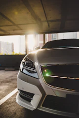 Side view of a luxury car with a flawless bicapa premium paint finish reflecting soft light.