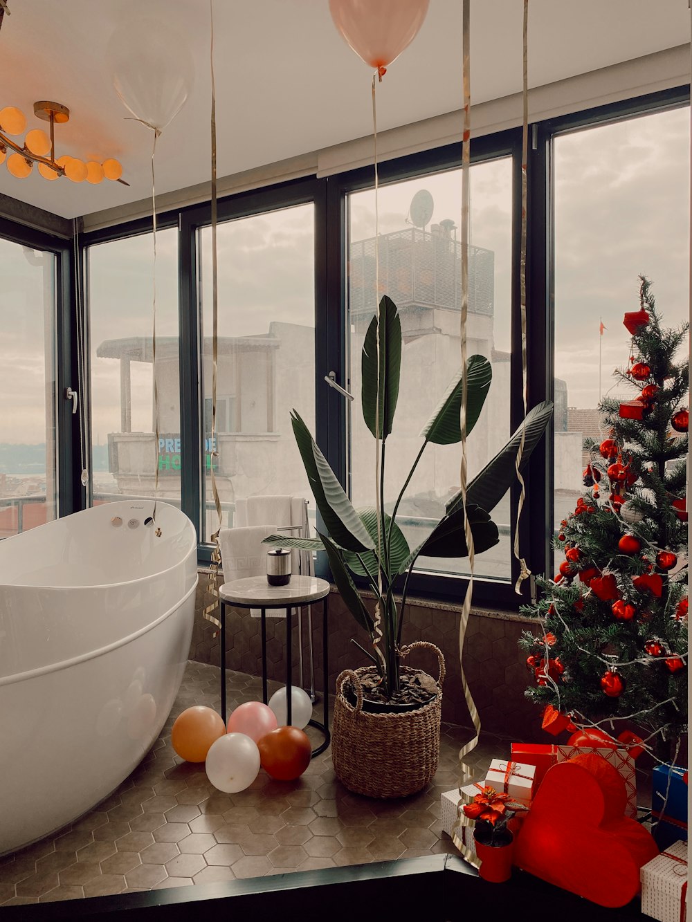 green potted plant near white bathtub