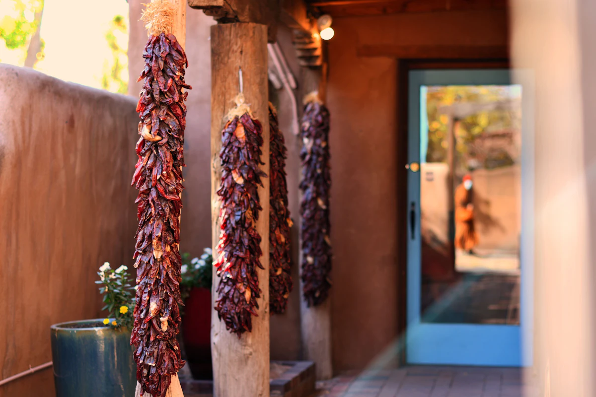 Ristras hanging by a Casa Sol doorway