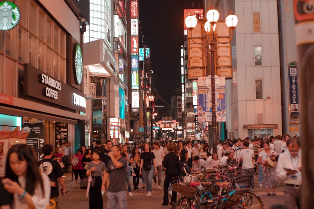 people walking on street during night time