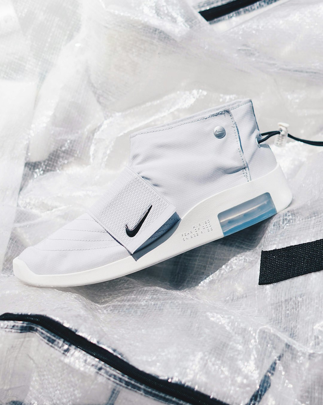 white and black nike athletic shoe