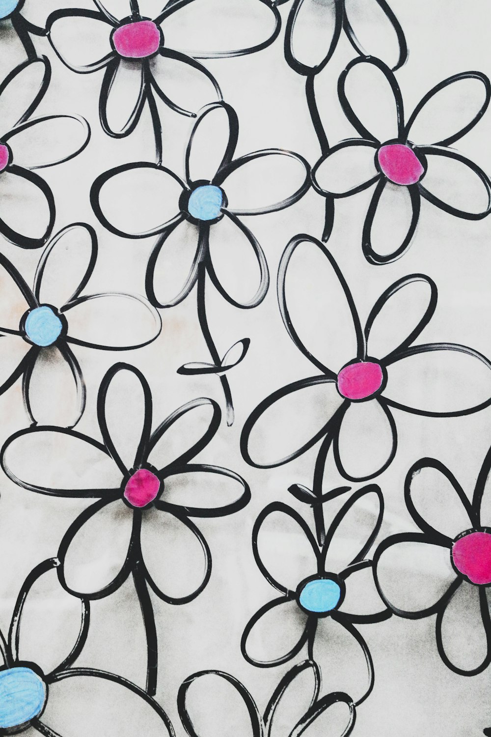 white pink and black floral textile