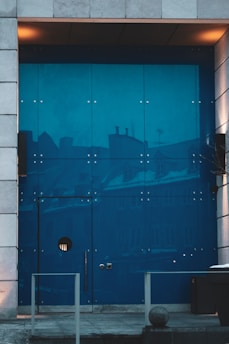 A modern glass door installed in a stylish entryway.