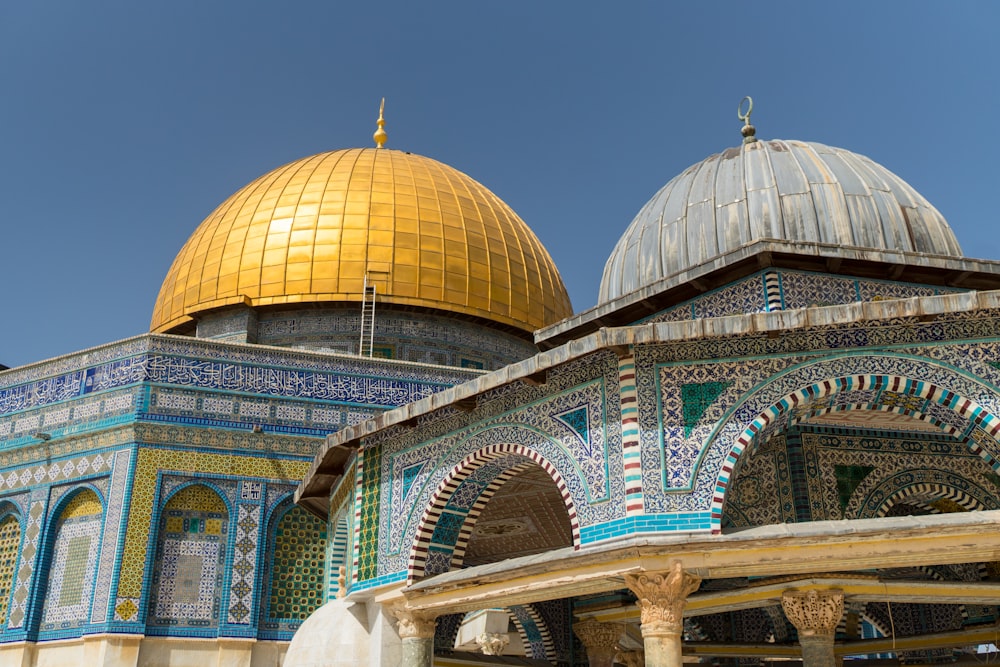 green and white dome building under blue sky during daytime