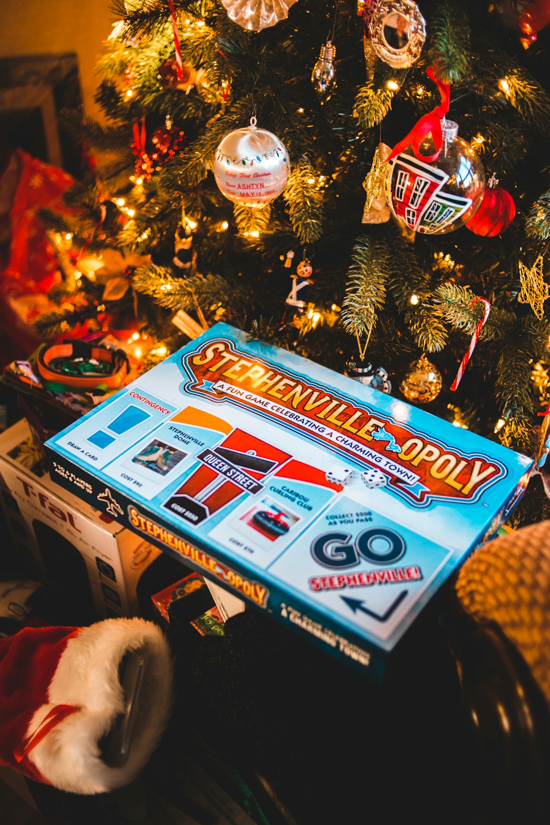 blue and white box beside christmas tree