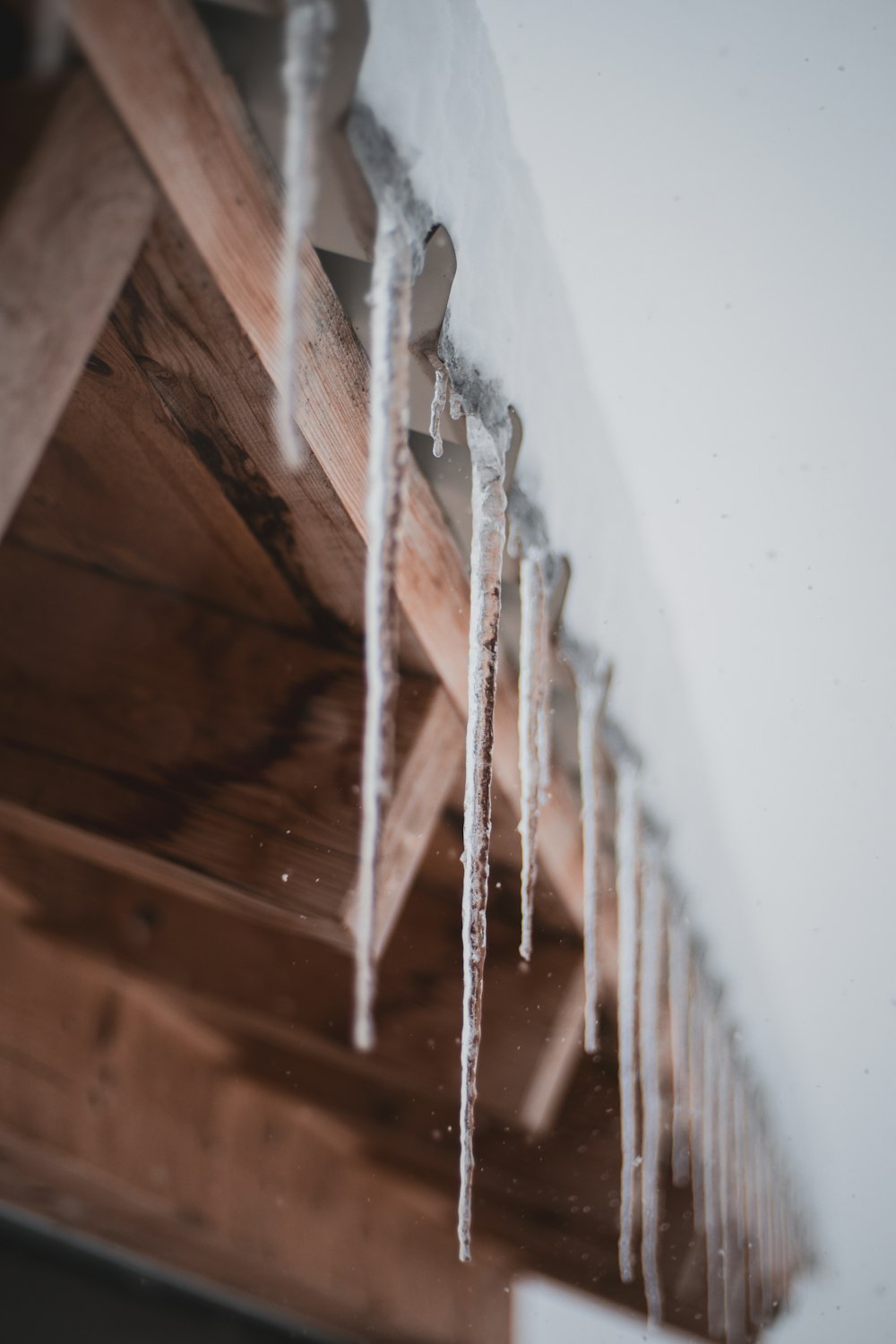 brown wooden fence with white coated wire