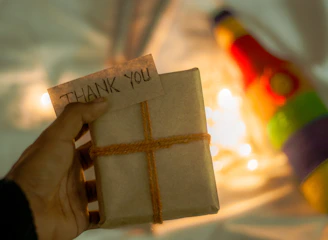 A beautifully wrapped surprise gift box with chocolates and a handwritten note