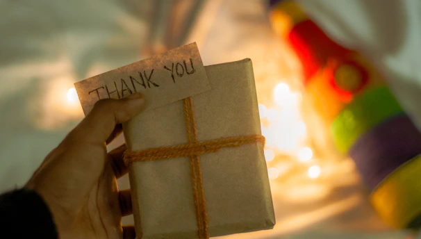 A beautifully wrapped surprise gift box with chocolates and a handwritten note