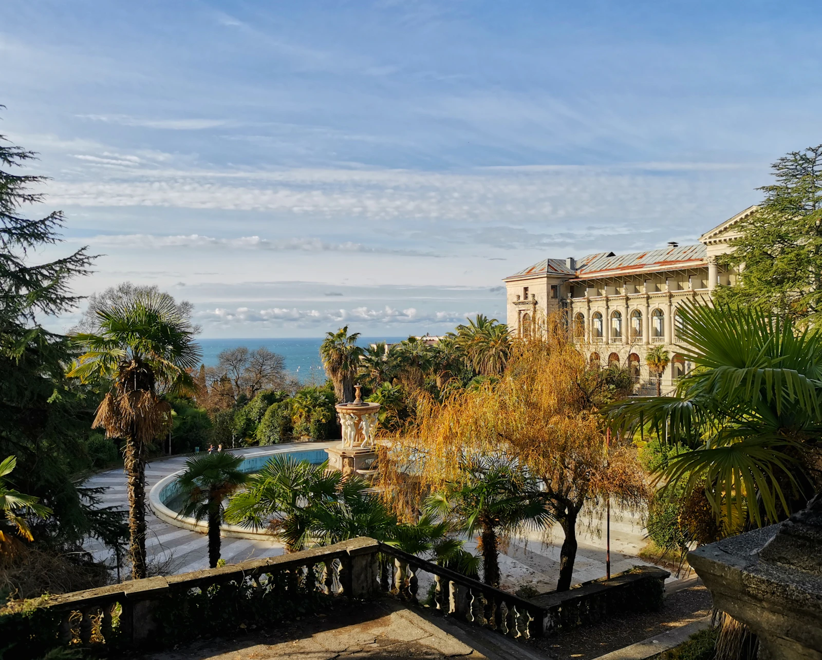 Palms and a sanatorium above the sea — Sochi, Russia