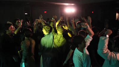 A joyful group of salsa dancers mid-spin in a warmly lit studio, smiles bright and energy high.
