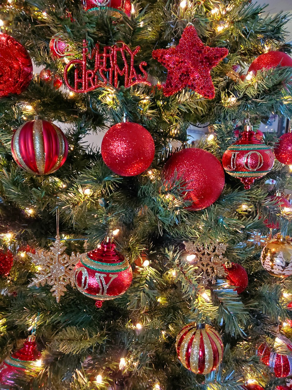 red and gold baubles on christmas tree