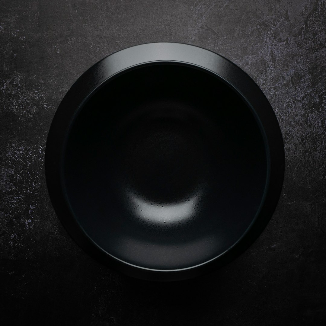 black round plate on black and gray surface