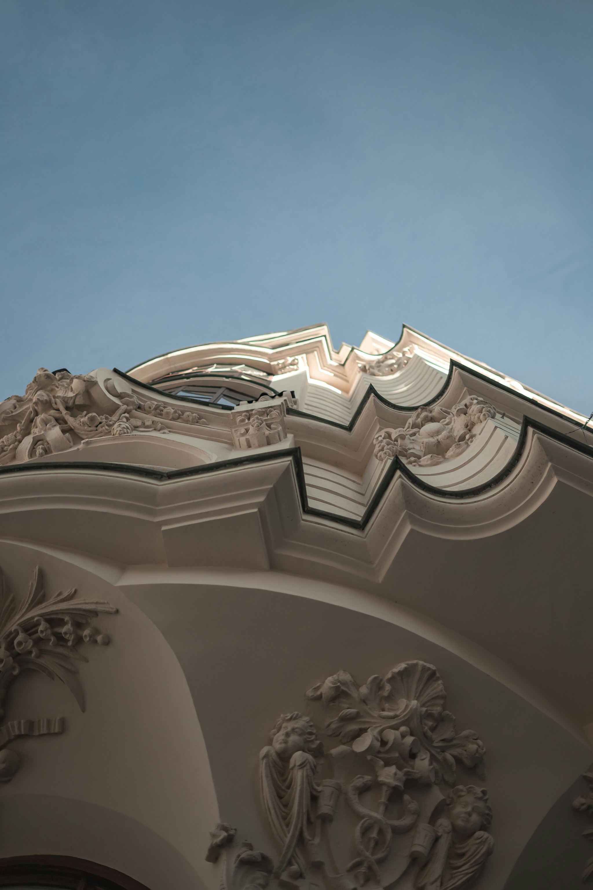 white concrete building under blue sky during daytime