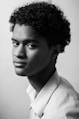 grayscale photo of man in white collared shirt