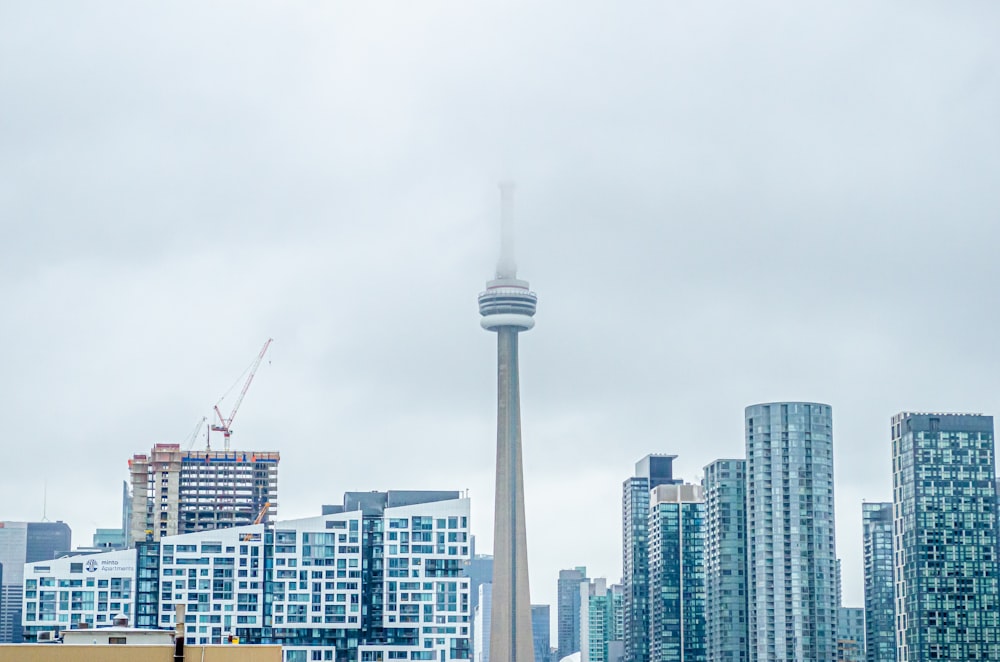 white and gray concrete buildings under white sky during daytime