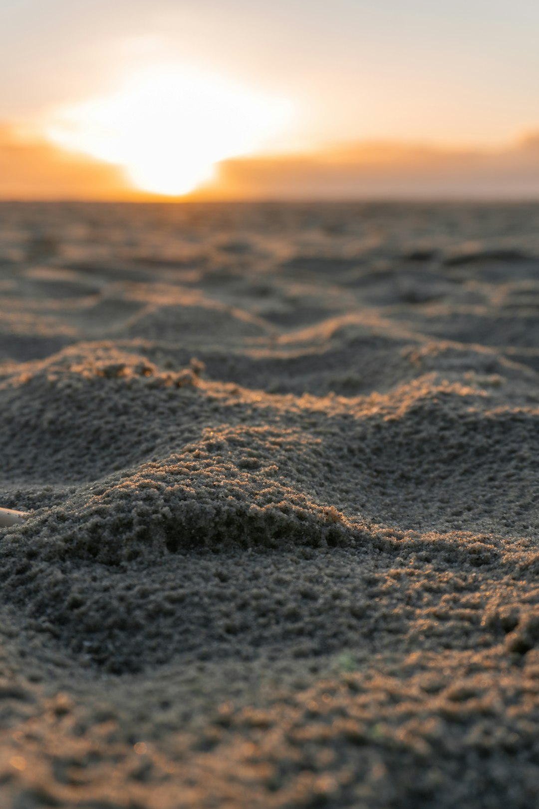 brown sand during sunset in close up photography