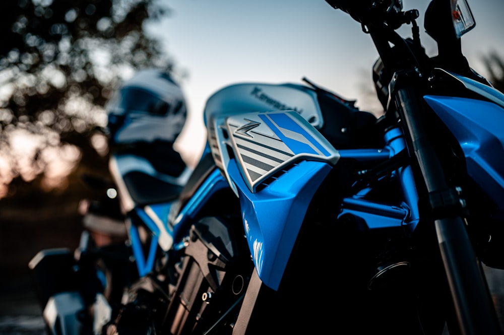 blue and black motorcycle during daytime